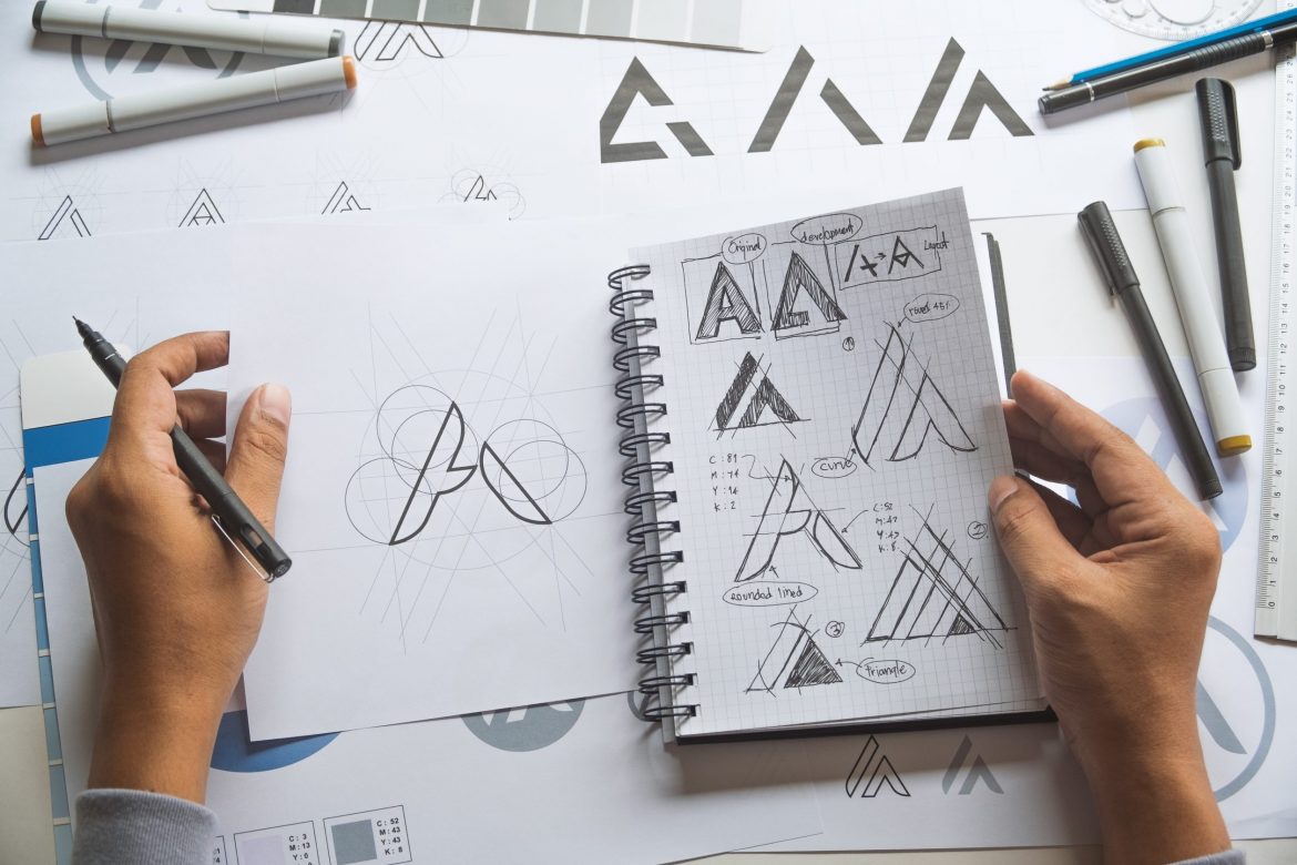 Graphic designer drawing sketch design creative Ideas draft Logo