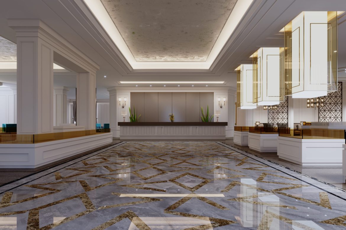 Hotel foyer with reception desk and columns in classic interior design.
